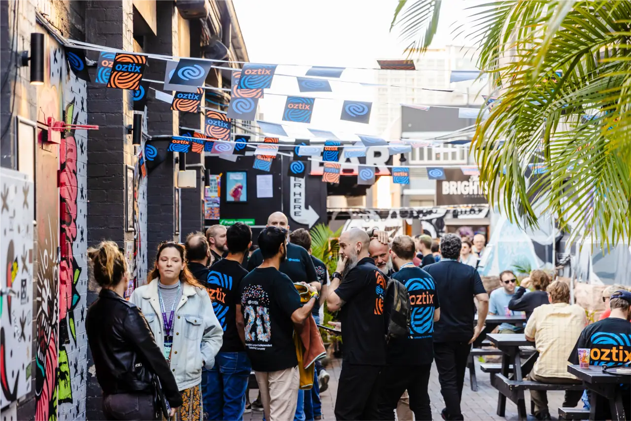 A real crowd in a laneway under Oztix bunting